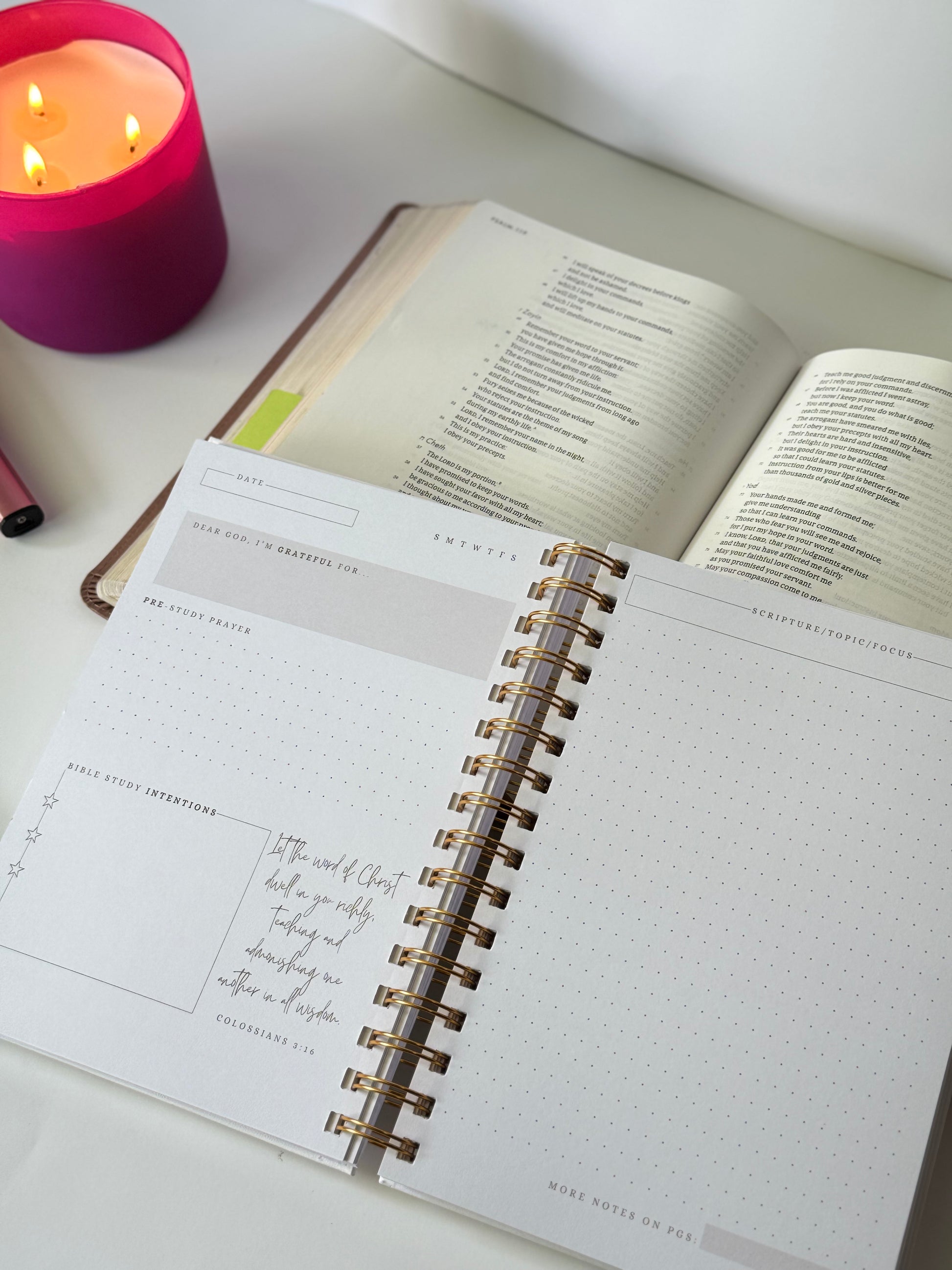 Bible study journal flat lay with Bible and candle